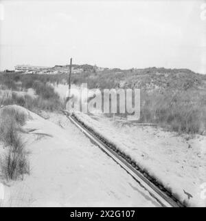 LES MEMBRES DE LA MARINE MARCHANDE ROYALE À L'EXERCICE DU TIR PENDANT LEUR COURS DE TIR ANTIAÉRIEN. 1941 - Une vue de la gamme d'entraînement, utilisé par les notations de la marine marchande, tout en s'entraînant comme artilleurs anti-aériens. Il montre la tranchée et le chariot utilisés pour déplacer les cibles Banque D'Images