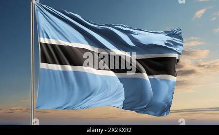 Die Fahne von Botswana flattert im Wind, isoliert gegen blauer Himmel Banque D'Images