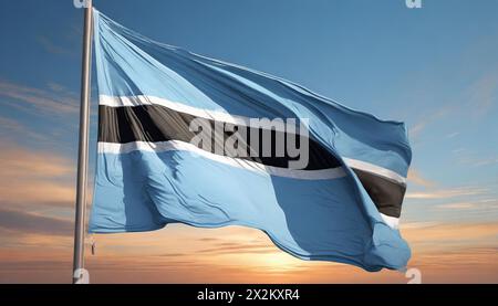 Die Fahne von Botswana flattert im Wind, isoliert gegen blauer Himmel Banque D'Images