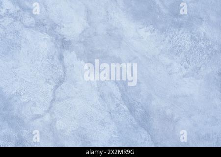 Un fond bleu avec un motif de texture de marbre dans un design fantaisiste élégant, des boucles ondulées et un motif de marbre incurvé sur une pierre blanche et bleu pastel détaillée. Superposition pour la conception. Photo de haute qualité Banque D'Images