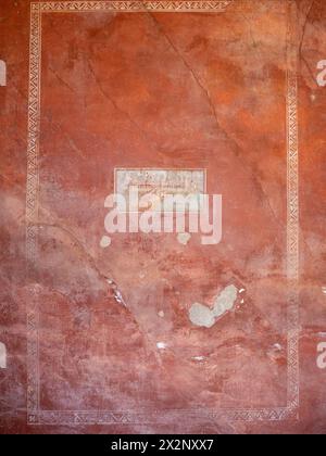 Peintures sur un mur rouge à Pompéi Italie Banque D'Images