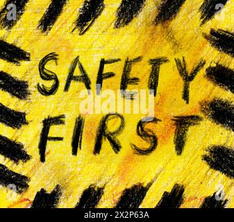 Sécurité premier signe grunge fait à la main, jaune avec des rayures de danger, isolé sur fond blanc Banque D'Images