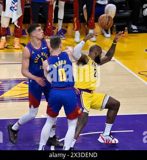 Los Angeles, États Unis. 25 avril 2024. L'attaquant des Lakers de Los Angeles LeBron James (23) tombe au sol alors qu'il est faussé par l'attaquant des Nuggets de Denver Christian Braun (0) lors de la deuxième mi-temps du match 3 de leur série éliminatoire de premier tour de la Western Conference au Crypto.com Arena à Los Angeles le jeudi 25 avril 2024. Photo de Jim Ruymen/UPI crédit : UPI/Alamy Live News Banque D'Images