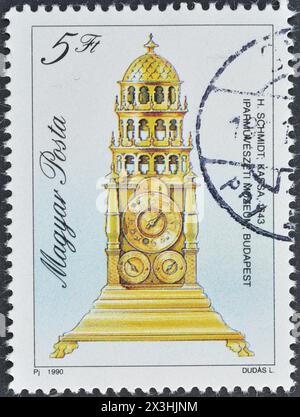 Timbre-poste oblitéré imprimé par la Hongrie, qui montre horloge de table, 1643, vers 1990. Banque D'Images