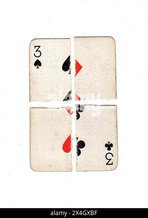 Une carte à jouer vintage à trois composée de quartiers déchirés de quatre costumes sur un fond blanc. Banque D'Images