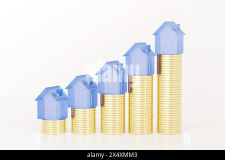 Concept d'investissement immobilier. Maisons de verre debout sur les piles de pièces de monnaie. Banque D'Images