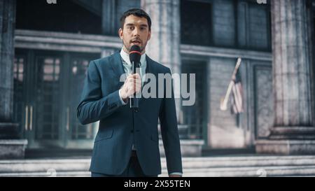 Anchorman rapporte Breaking News en direct devant un Parlement des États-Unis d'Amérique, un tribunal ou un autre bâtiment gouvernemental avec colonnes. Newsreader livre un programme journalistique à la télévision. Banque D'Images