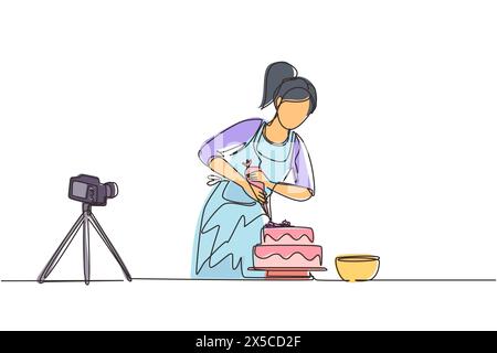 Ligne continue simple dessinant fille de cuisson et de décoration gâteau à la cuisine. Femme blogueuse enregistrant la vidéo sur la caméra, en utilisant un trépied, le postant sur les réseaux sociaux Illustration de Vecteur
