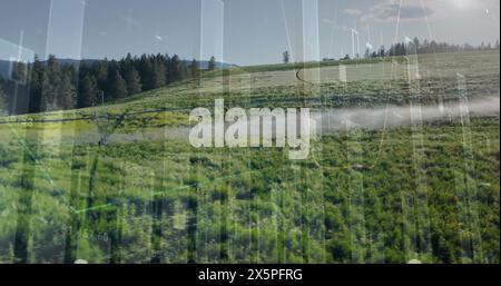 Image de graphiques financiers au-dessus d'un paysage de prairie Banque D'Images