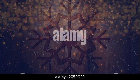 Image de neige tombant et des taches lumineuses sur flocon de neige sur fond de bois Banque D'Images