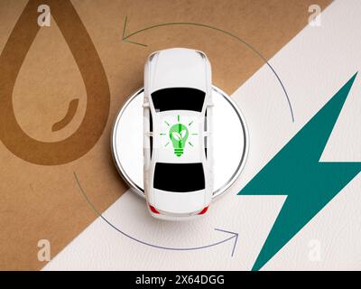 Voiture hybride, énergie renouvelable, sauver le concept de la terre. Énergie de l'ampoule verte avec panneau de feuille sur le toit de jouet de voiture blanc entourant avec une partie de demi-section Banque D'Images