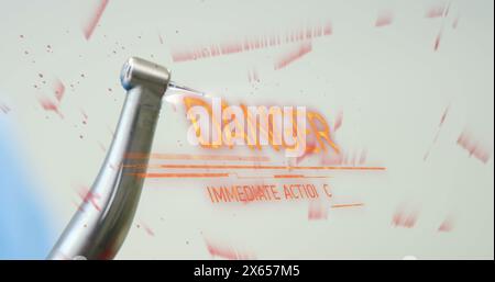 Image du texte danger sur la perceuse dentaire Banque D'Images