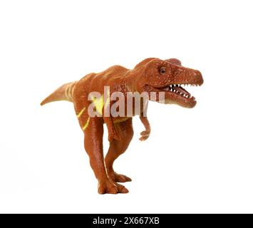 Réplique de jouet détaillée d'un tyrannosaurus rex positionné sur un fond blanc sans couture, adapté au contenu éducatif Banque D'Images