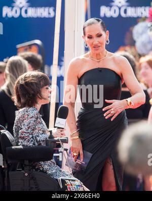 Londres, Royaume-Uni. 12 mai 2024 Liz Carr et Michelle visage assistent aux BAFTA Television Awards au Royal Festival Hall. Carr est comédienne, actrice et militante des droits des personnes handicapées. Visage est un chanteur et diffuseur américain. Crédit : Prixpics/Alamy Live News Banque D'Images