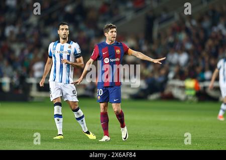 Barcelone, Espagne. 13 mai 2024. (G-d) Mikel Merino (Sociedad), Sergi Roberto (Barcelone) Football/Football : Espagnol 'LaLiga EA Sports' match entre le FC Barcelone 2-0 Real Sociedad aux Estadi Olimpic Lluis Companys à Barcelone, Espagne . Crédit : Mutsu Kawamori/AFLO/Alamy Live News Banque D'Images