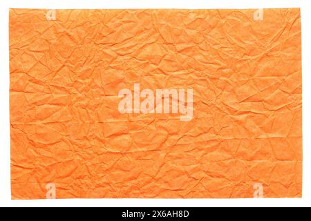 Feuille de papier froissée isolée de couleur orange brillant. Banque D'Images