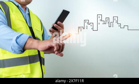 Ingénieur civil architecte à l'aide d'un smartphone pour communiquer et donner des ordres à l'équipe de construction, Engineer Building concept, fond pour constru Banque D'Images