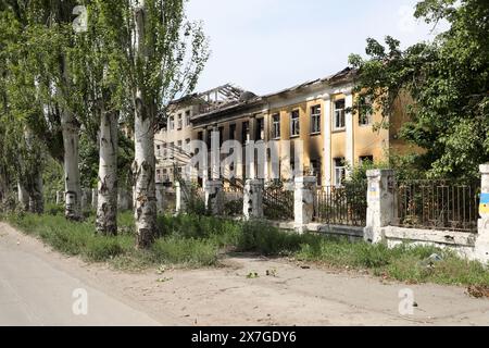 Chasiv YAR, UKRAINE - le 18 MAI 2024 - Une école est détruite par des bombardements russes, Chasiv Yar, dans la région de Donetsk, dans l'est de l'Ukraine. Banque D'Images