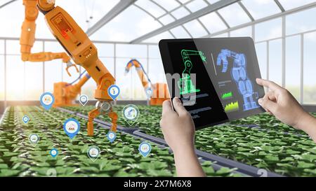 Concept de technologie agricole avec bras robotique de rendu 3d de commande humaine avec tablette numérique en serre Banque D'Images