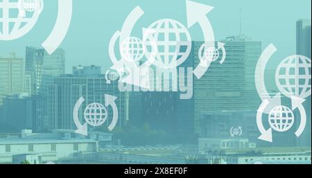 Image de plusieurs icônes de globe Web flottant contre une vue aérienne du paysage urbain Banque D'Images