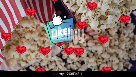 Image du texte et de l'icône similaires sur des coeurs rouges et du pop-corn Banque D'Images