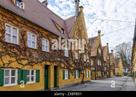 Bâtiment dans le complexe résidentiel historique Fuggerei dans la vieille ville d'Augsbourg, Augsbourg, Souabe, Bavière, Allemagne Banque D'Images