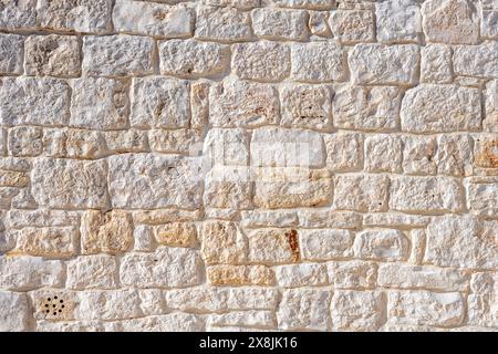 Fond d'un vieux mur de pierre naturelle vu en Italie Banque D'Images