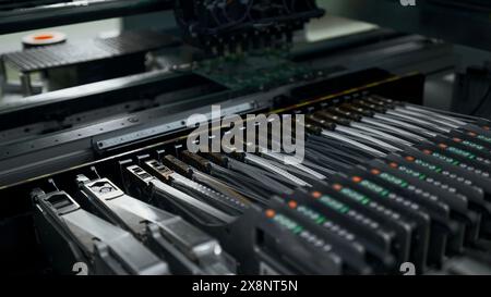 Automated technology, industrial, robotic manufacturing concept. Creative. Automation machine equipment for quality testing of printed circuit boards. Banque D'Images