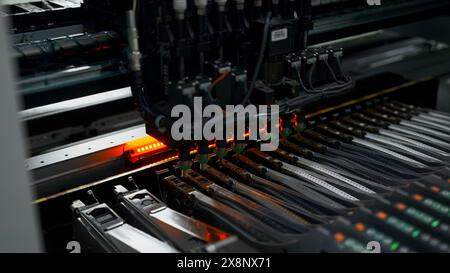 Automated technology, industrial, robotic manufacturing concept. Creative. Automation machine equipment for quality testing of printed circuit boards. Banque D'Images