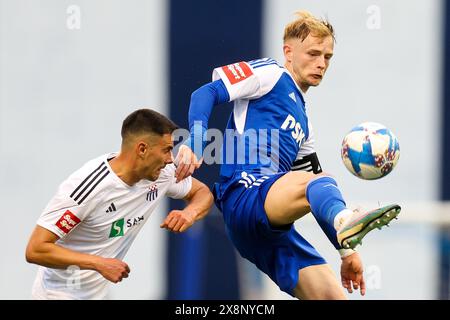 Zagreb. 26 mai 2024. Maxime Bernauer (R) du Dinamo Zagreb contrôle le ballon lors du 36e tour de la ligue crotienne de football entre le GNK Dinamo Zagreb et Rudes à Zagreb, Croatie, le 26 mai 2024. Crédit : Marko Lukunic/PIXSELL via Xinhua/Alamy Live News Banque D'Images