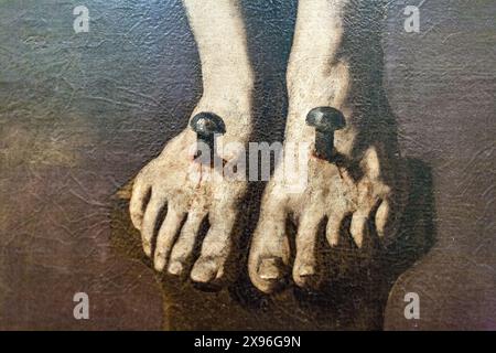 Détail montrant les pieds cloués du Christ mourant d'une peinture du XVIIe siècle de Zurbarán, située au Musée des Beaux-Arts de Séville, en Espagne. Banque D'Images