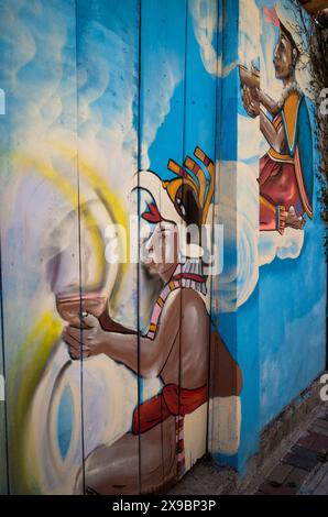 Murale représentant des scènes de la mythologie maya, rue connue sous le nom de Hippie Highway, San Marcos la Laguna, connue pour une grande population d'expatriés yogis et al Banque D'Images