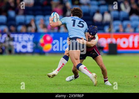 Sydney, Australie. 31 mai 2024. Mark Nawaqanitawase des Waratahs est attaqué lors du match de Super Rugby Pacific 2024 Rd15 entre les Waratahs de la NSW et les Reds du QLD à l'Allianz Stadium le 31 mai 2024 à Sydney, Australie crédit : IOIO IMAGES/Alamy Live News Banque D'Images