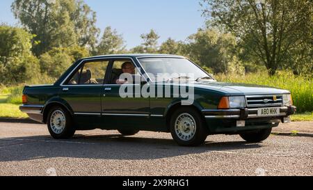 Stony Stratford, Royaume-Uni - 2 juin 2024 : 1983 Ford Granada ghia voiture conduite sur une route de campagne britannique Banque D'Images