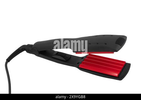 Fer à friser les cheveux isolé sur fond blanc. Fer à friser électrique avec plaques céramiques isolées. Banque D'Images