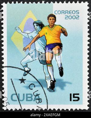 Timbre-poste oblitéré imprimé par Cuba, qui montre joueur de football brésilien, Coupe du monde de la FIFA 2002 - Corée et Japon, vers 2002. Banque D'Images