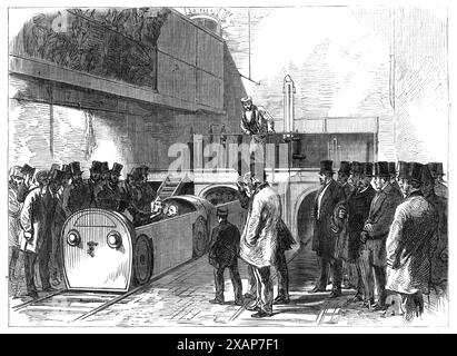 Le tube d'évacuation pneumatique : l'extrémité Holborn du tube le jour de l'ouverture, 1865. Inauguration d'un «transport par propulsion atmosphérique à travers un tube», pour la livraison de sacs postaux «de et vers le siège postal à Londres... [et] entre les différentes gares ferroviaires et marchandises d&#xe9;p&#xf4;TS...reliant avec ces lignes les six principaux marchés londoniens et d'autres points importants... le duc de Buckingham, Président de la Pneumatic Despatch Company, avait invité un certain nombre de messieurs scientifiques à inspecter l'appareil. Après que le train ait fait quelques passages réussis dans les deux sens, s Banque D'Images