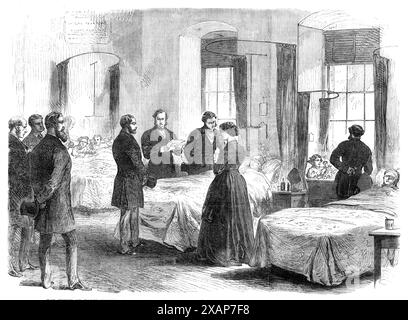 Le prince de Galles rend visite à des personnes à l'hôpital de Bartholomew blessées par l'explosion de Clerkenwell, 1868. Le futur roi Édouard VII rend visite aux survivants '...blessés par l'explosion du mur à Clerkenwell...son Altesse Royale est arrivée vers midi, accompagnée du duc de Sutherland et de plusieurs autres messieurs, dans deux voitures privées. Ils ont été accueillis par le secrétaire et le trésorier, et certains chirurgiens de l'hôpital, et conduits aux lits où ces patients étaient couchés. Le prince leur a exprimé sa sympathie, et ils semblaient très heureux de son attention. Sur 13 d Banque D'Images