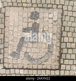 Sonderborg, ALS, ville de Sonderborg, symbole personne handicapée, personne en fauteuil roulant, pavés, cadre, île d'Alsen, Fjord de Flensburg, mer Baltique Banque D'Images