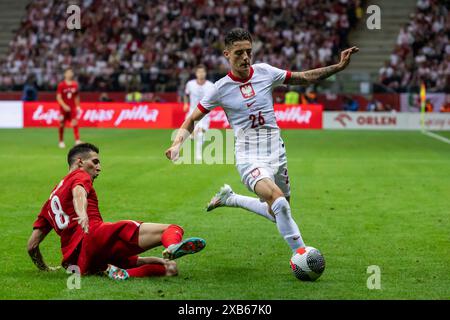 Varsovie, province de Mazovie, Pologne. 10 juin 2024. Mert Muldur (à gauche), Kacper Urbanski (à droite) lors du match international amical de football entre la Pologne et la Turquie au stade national de Varsovie. Crédit : ZUMA Press, Inc/Alamy Live News Banque D'Images