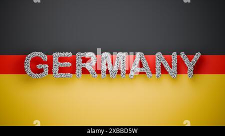 Le texte ALLEMAGNE fabriqué à partir de ballons de football devant un fond noir rouge or comme le drapeau allemand. Concept pour événements de football en Allemagne Banque D'Images