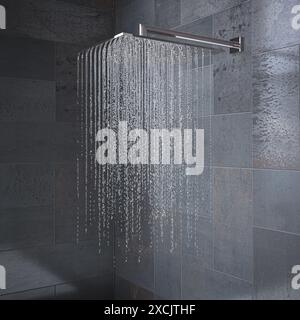 Pomme de douche moderne pulvérise de l'eau dans une salle de bains carrelée grise Banque D'Images