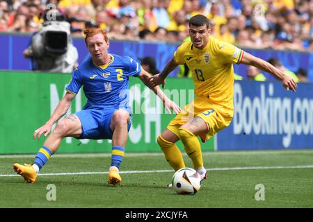 MUNICH, ALLEMAGNE - 17 JUIN : Yukhym Konoplia de l'Ukraine et Valentin Mihaila de Ramania lors du match de la phase de groupes de l'UEFA EURO 2024 entre la Roumanie et l'Ukraine au Munich Football Arena le 17 juin 2024 à Munich, Allemagne.240617 SEPA 24 035 - 20240617 PD8600 crédit : APA-PictureDesk/Alamy Live News Banque D'Images