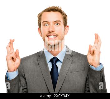 Homme d'affaires, portrait et doigts croisés pour la chance en studio avec promotion, giveaway et en attente d'annonce. Personne, nerveux et emoji avec Banque D'Images