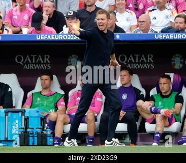 Stuttgart, UEFA Euro 2024 Groupe A match entre l'Allemagne et la Hongrie à Stuttgart. 19 juin 2024. Julian Nagelsmann (avant), entraîneur-chef de l'Allemagne, fait des gestes lors du match UEFA Euro 2024 Groupe A entre l'Allemagne et la Hongrie à Stuttgart, Allemagne, le 19 juin 2024. Crédit : Philippe Ruiz/Xinhua/Alamy Live News Banque D'Images