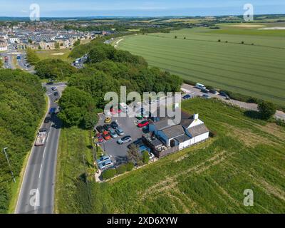 Poundbury, Dorchester, Dorset, Royaume-Uni. 20 juin 2024. Vue aérienne du restaurant McDonalds à Monkey’s Jump à côté de l’A35 à Poundbury à Dorchester dans le Dorset par une chaude journée d’été. Crédit photo : Graham Hunt/Alamy Live News Banque D'Images