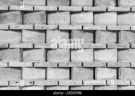 Fond de mur de briques en béton. Fond de bloc de carreaux de ciment gris, texture de la surface de brique. Banque D'Images