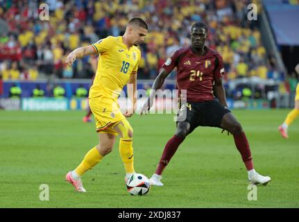 Razvan Marin de Roumanie, Amadou Onana de Belgique lors de l'UEFA Euro 2024, Groupe E, match de football entre la Belgique et la Roumanie le 22 juin 2024 au stade de Cologne, Allemagne - photo Jean Catuffe / DPPI Banque D'Images