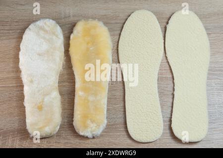 Semelles intérieures en peau de mouton blanche naturelle offrant chaleur et confort pour les pieds, idéales pour les chaussures d'hiver, douceur et soutien Banque D'Images