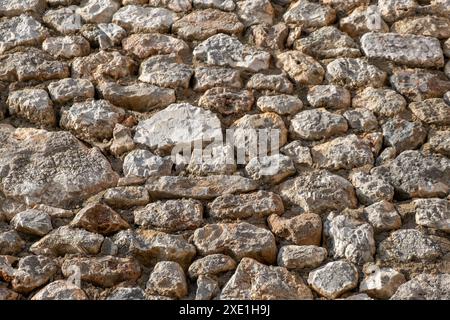 Texture d'un mur de pierre.Vieux château mur de pierre texture arrière-plan. Banque D'Images